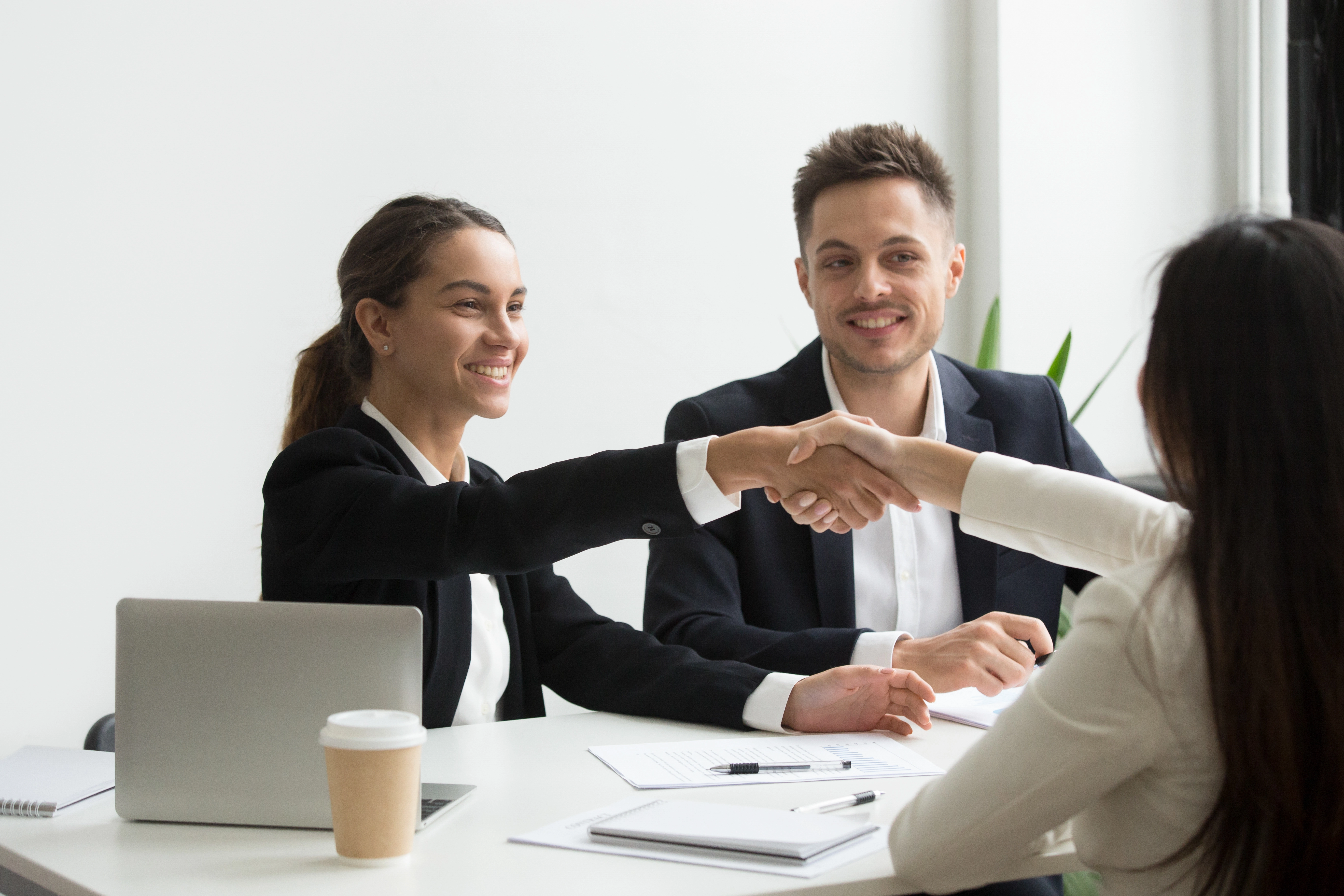 hr-representatives-positively-greeting-female-job-candidate.webp